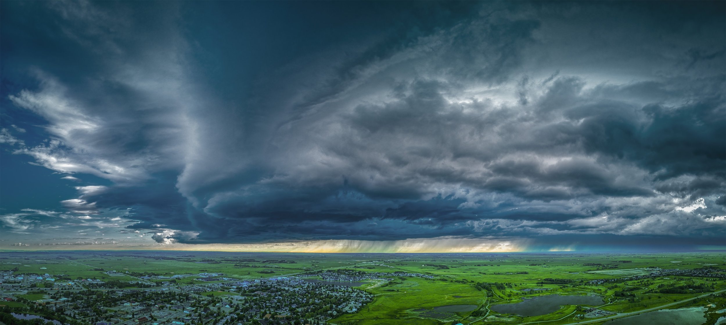 That came out of nowhere, Thomas Drive looking NW, Strathmore, AB, 2026-07-01